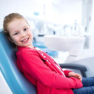 little girl in the dentists chair