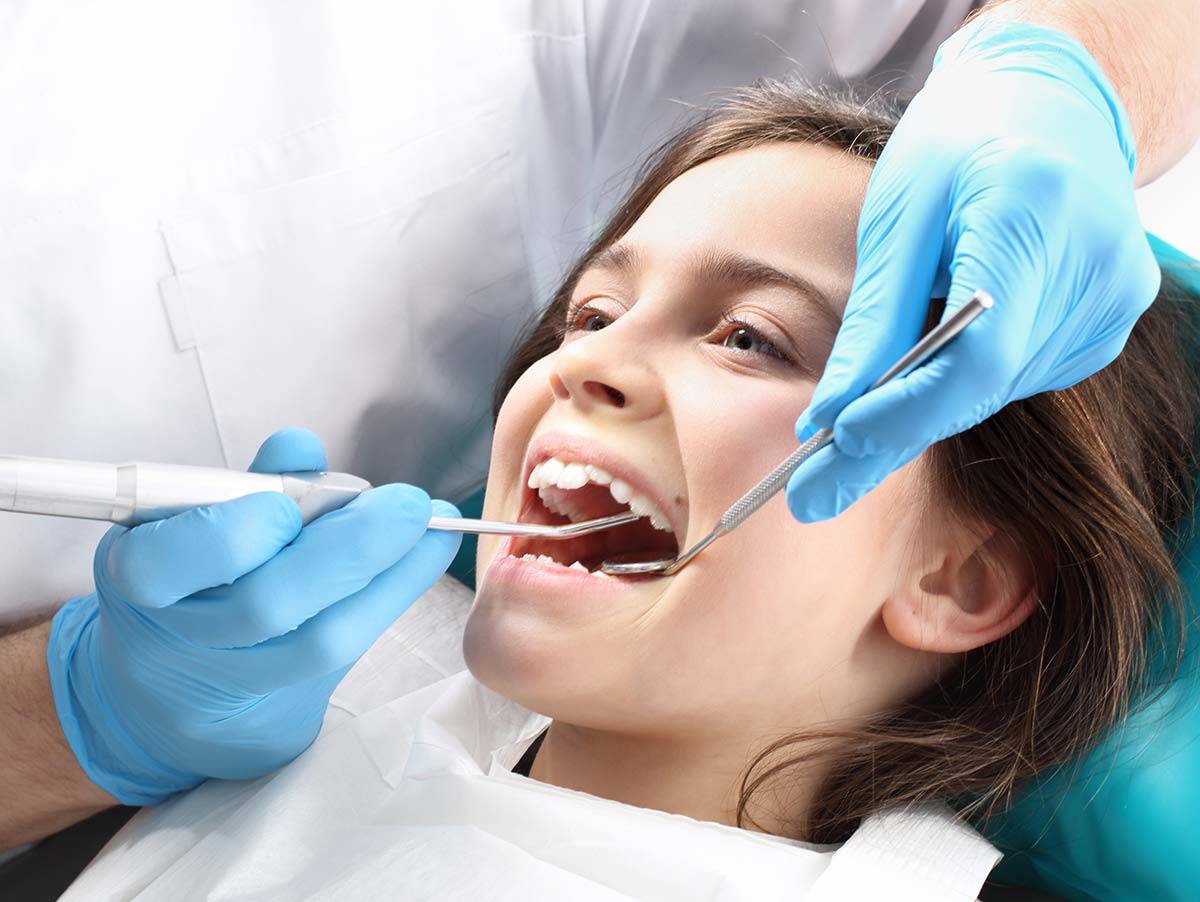 Taking your child to the dentist to have regular cleanings is part of cavit...