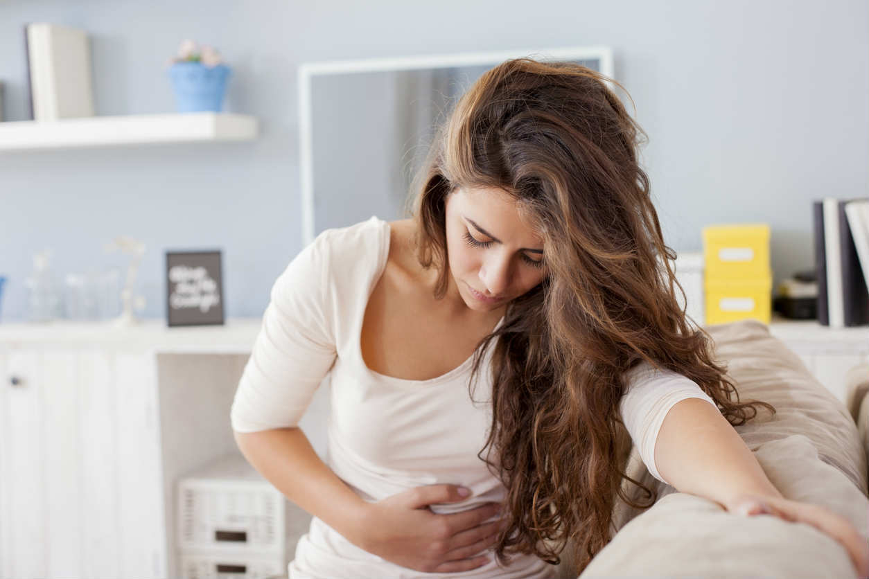 woman who is nauseous after dental sedation