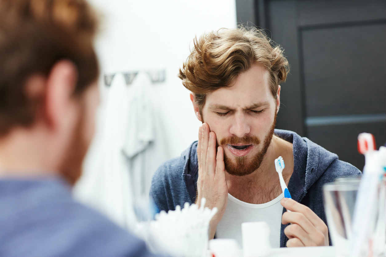 man with sensitive teeth