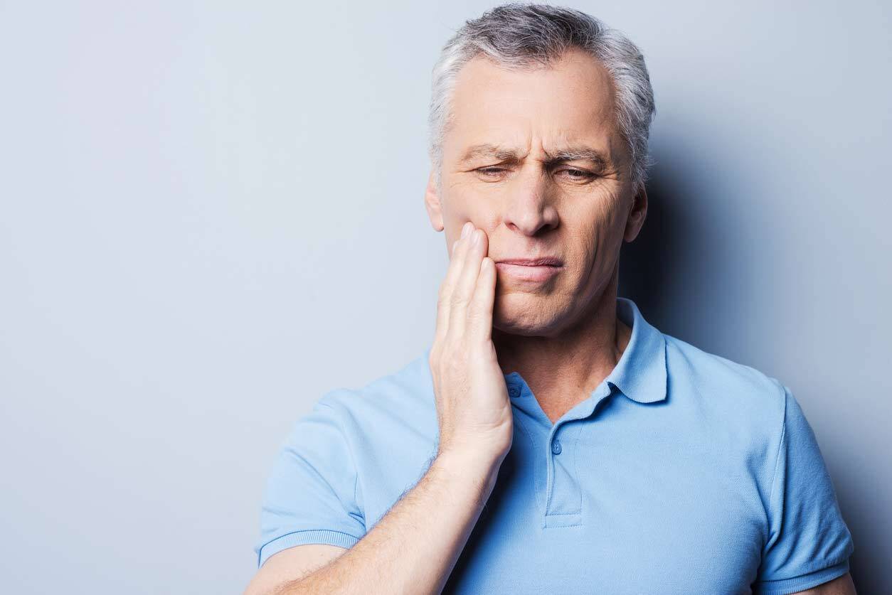 man with toothache