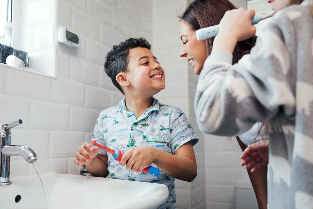 mother looking at childs teeth