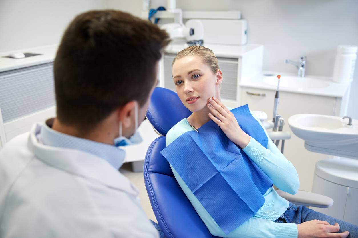 woman discussing anxiety with dentist