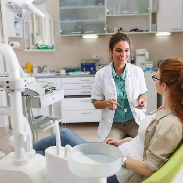St. Louis woman talking with her dentist