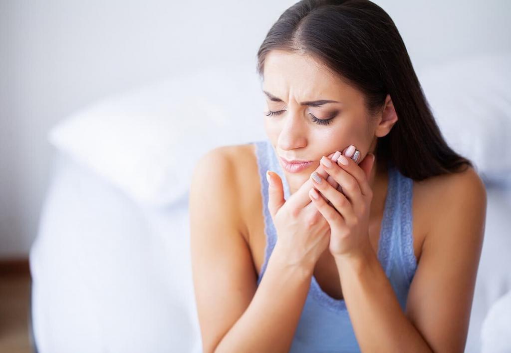 woman with pain from grinding her teeth