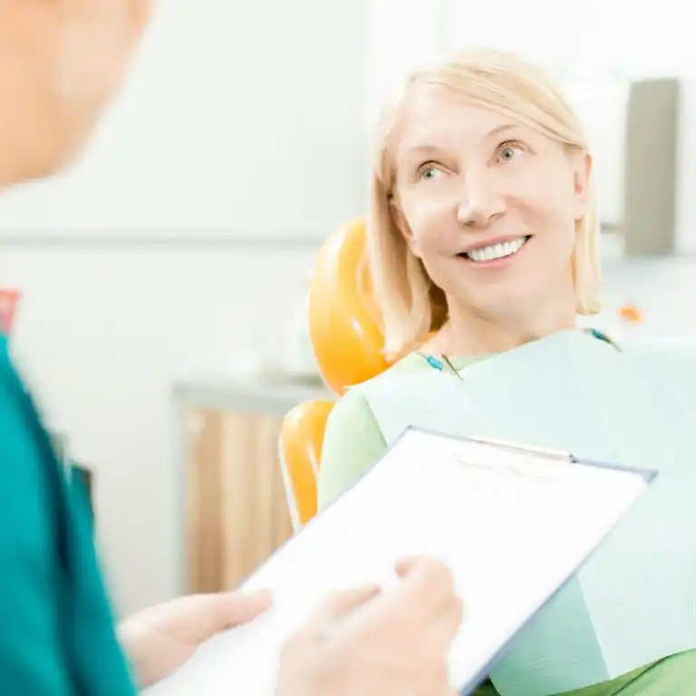 discussing medical history with dentist